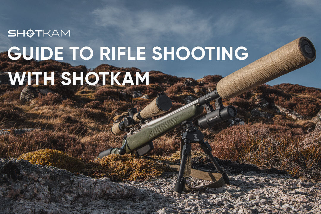 Rifle with ShotKam camera mounted in rugged outdoor terrain