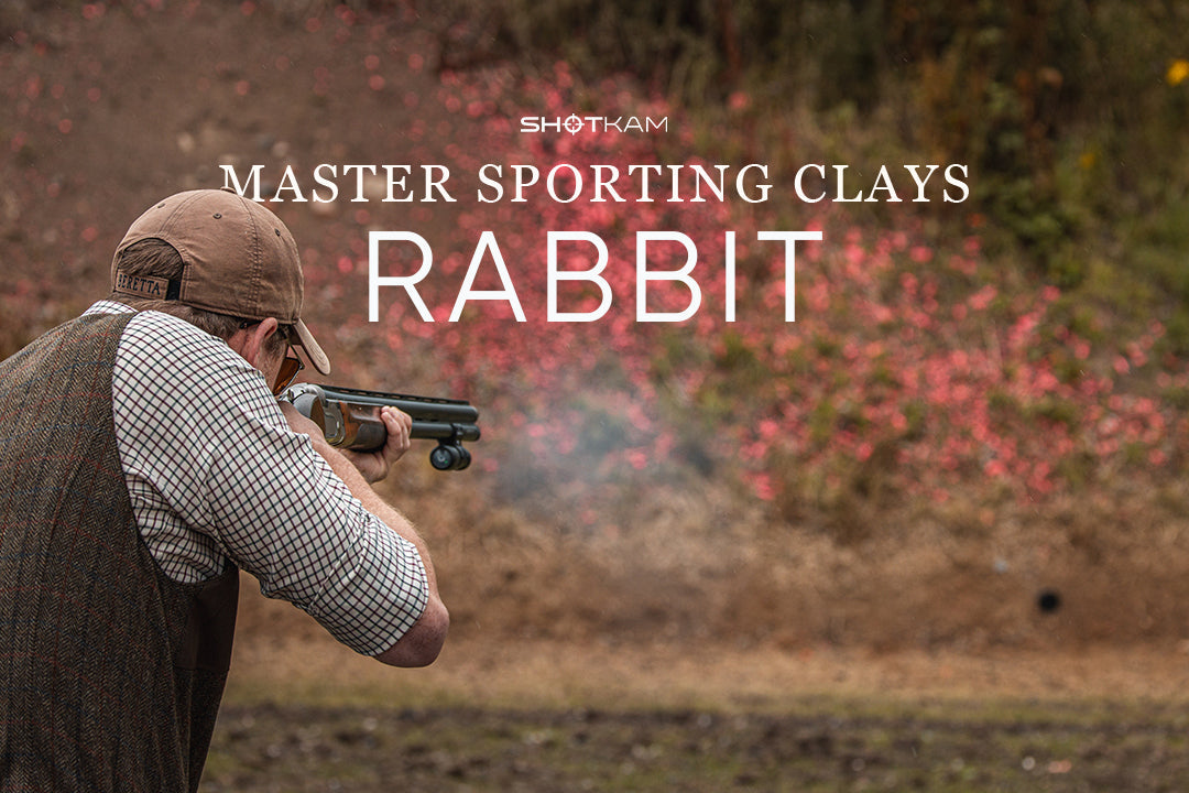 Shooter aiming at a rabbit clay target during sporting clays practice with ShotKam.