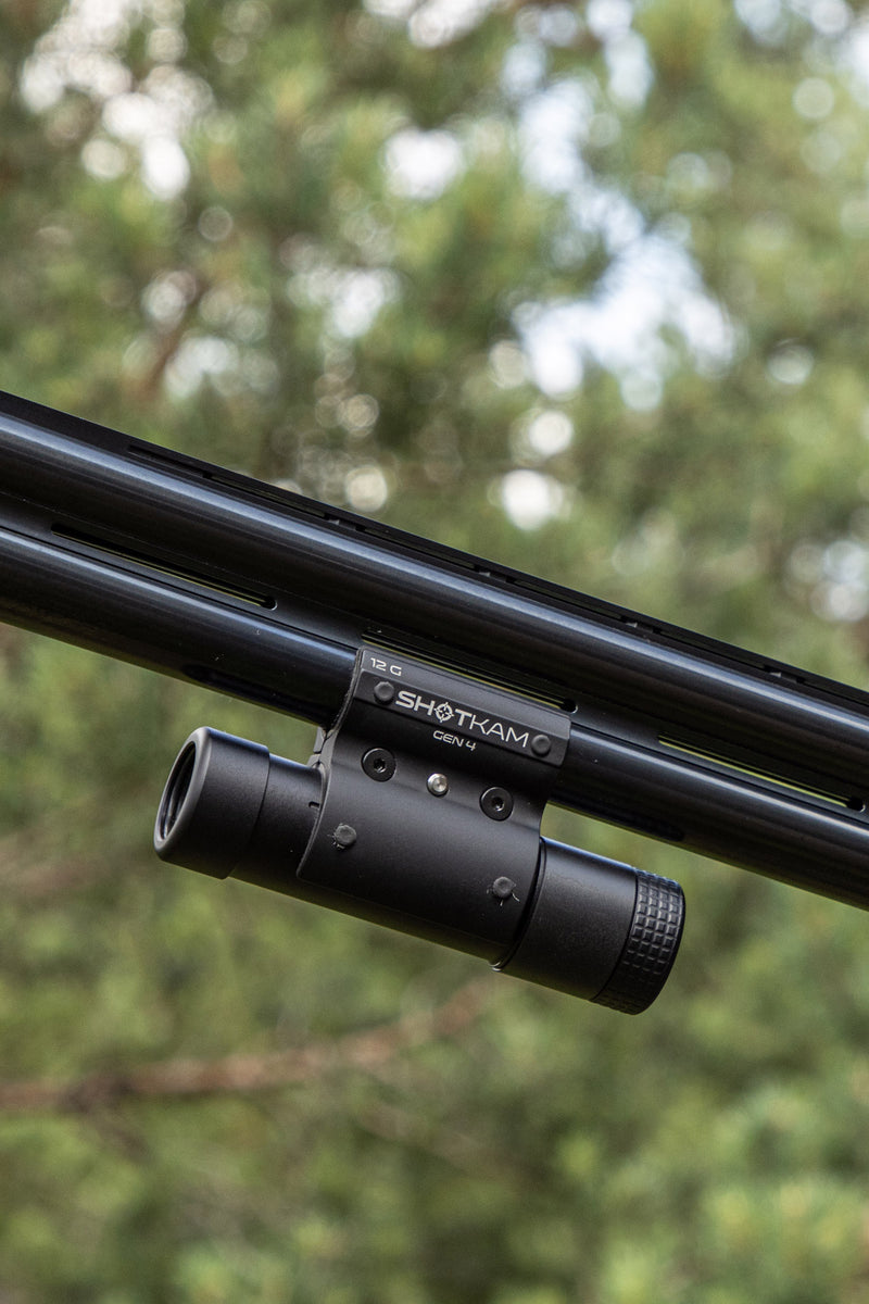 ShotKam Gen 4 mounted to a over and under shotgun barrel to capture 4k video of sporting clays and trap shooting