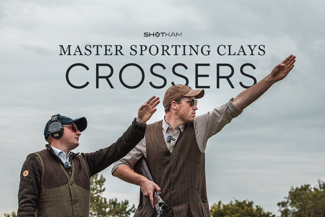 Two men in shooting vests demonstrating clay target techniques with ShotKam, highlighting crossers in Master Sporting Clays.