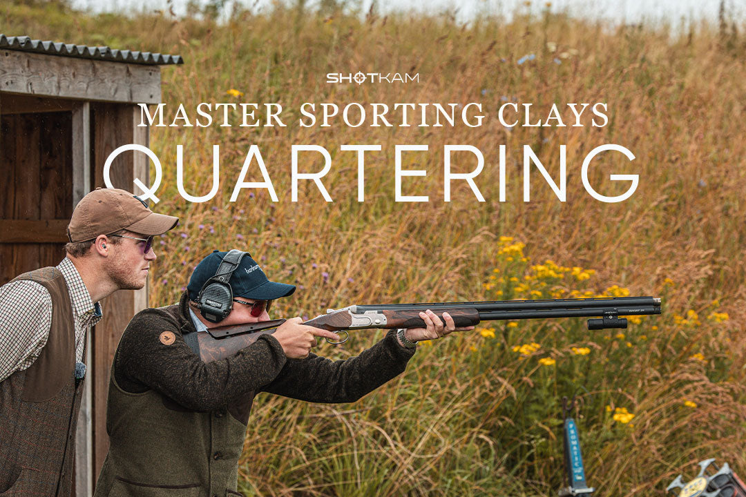 Coach instructing a shooter on quartering targets with a shotgun, showcasing a ShotKam mounted on the barrel.