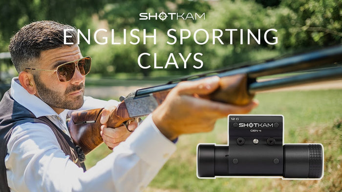 A shooter aiming a shotgun during an English Sporting Clays event with a ShotKam camera mounted on the barrel, featuring the ShotKam logo and text 'English Sporting Clays.'